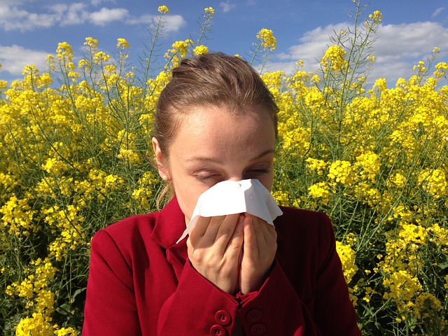 woman with allergies in field
